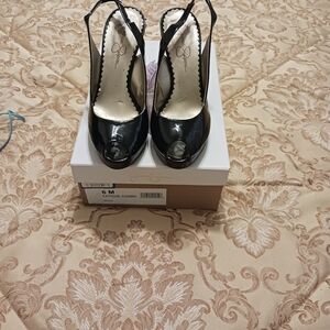 Jessica Simpson, 5.5 Black with animal print platform & heel.